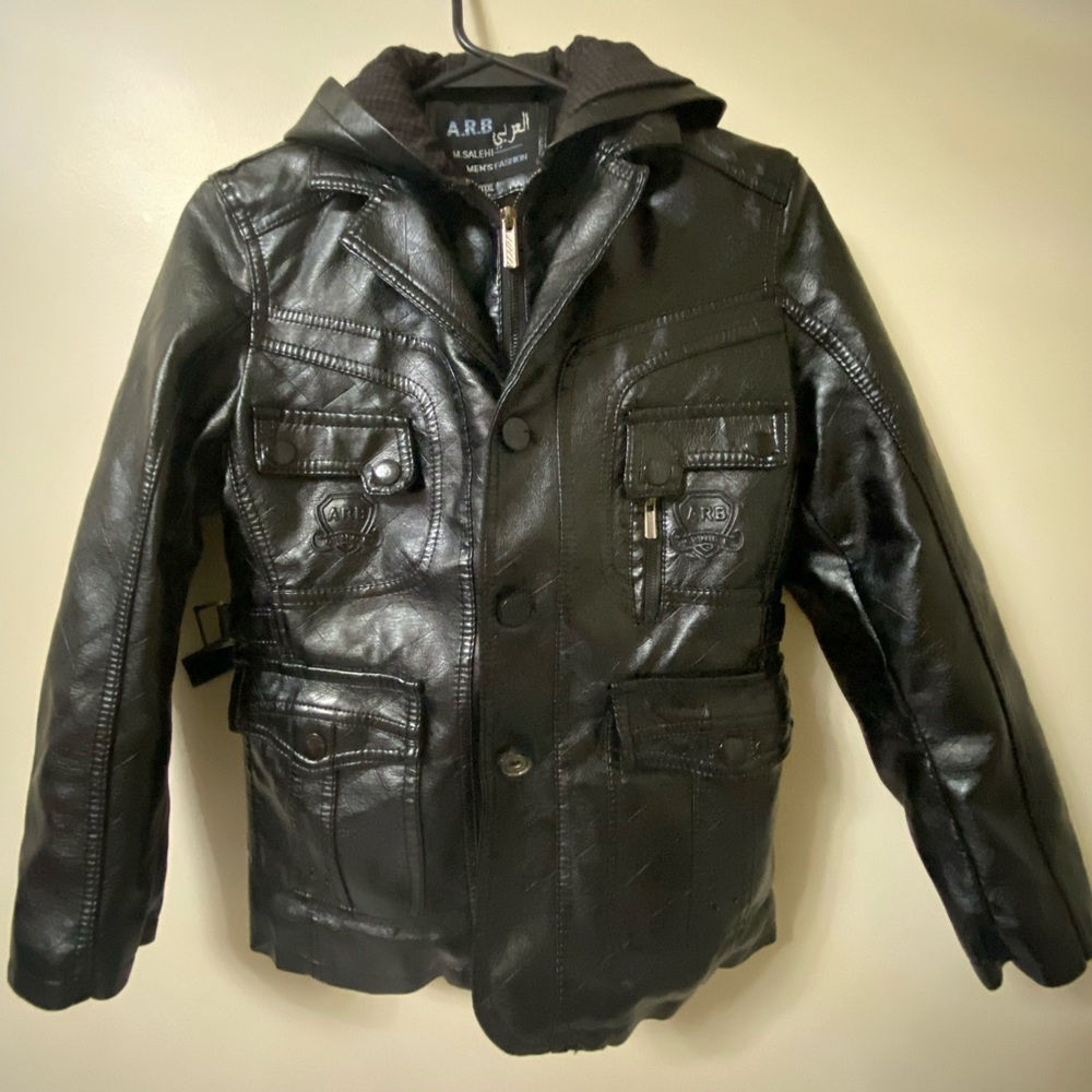 Thick, warm, black leather junior coat. Stylish zip up & button up. Fur interior
